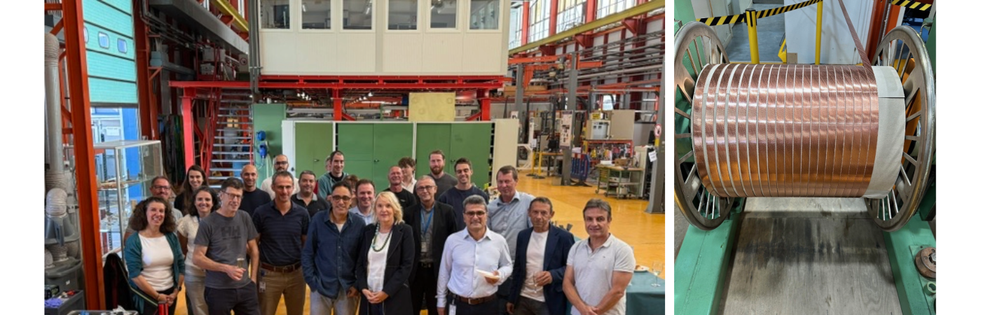 22 people posing for group photo, and a spool with copper-coloured cable on it
