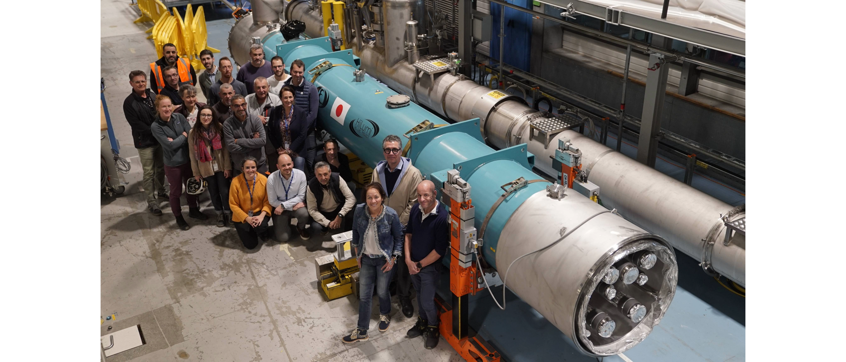 group of people smiling gathering in front of a teal magnet