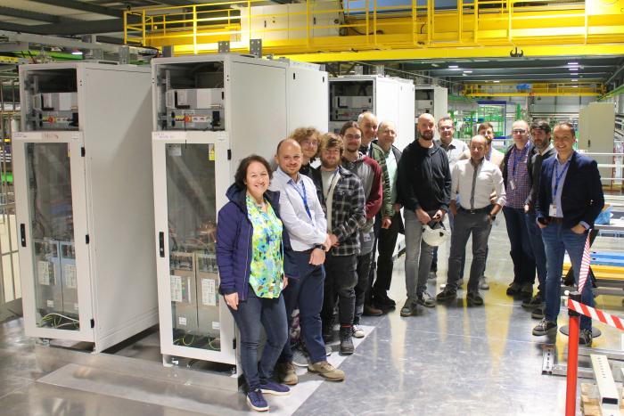 HL-LHC WP16 and HL-LHC WP7 teams next to the installed Energy Extraction Systems (Credit: CERN/ I. Garcia)