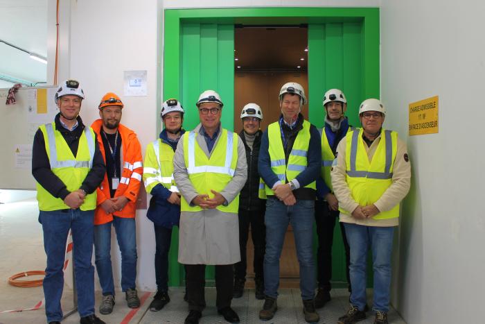 CERN and Schindler representatives next to the brand-new lift (Image: Irene Garcia Obrero)